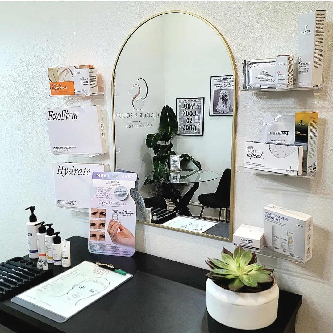 Glo2Facial OxyPod formulations including ExoFirm and Hydrate stocked on the retail wall at Contour & Sculpt Aesthetics